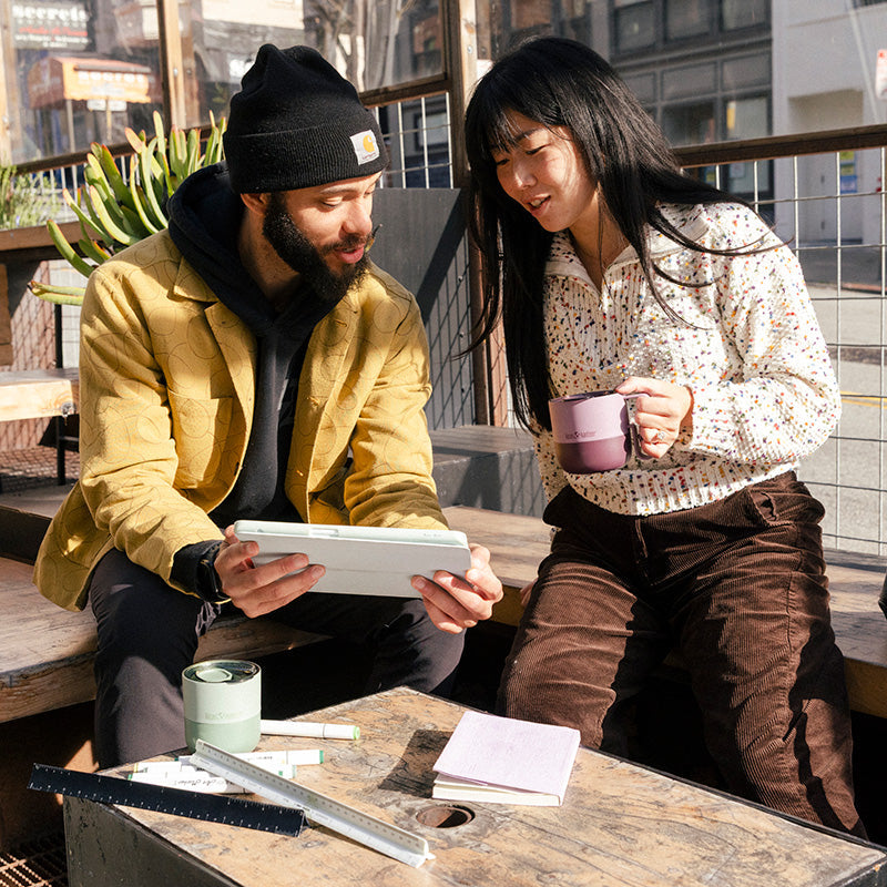12oz-rise-mug-k3 12oz_rise_coffee_mug_dusty_orchid_couple_city_patio_square.jpg