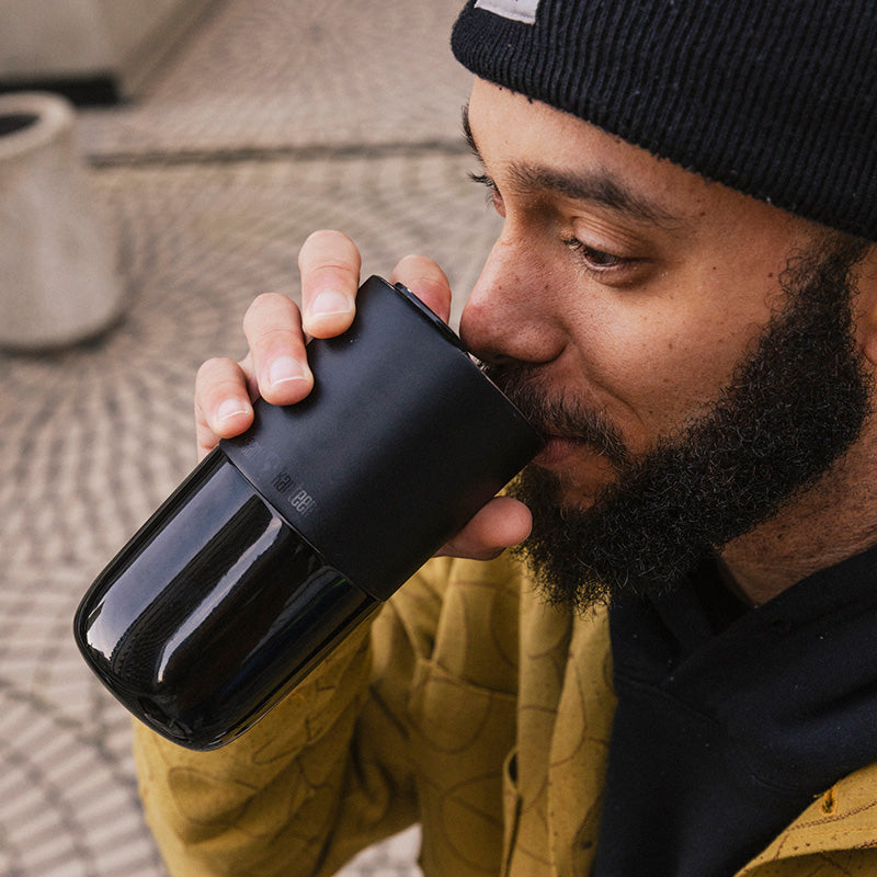 16oz-rise-tumbler-b4 16oz_rise_tumbler_black_man_drink_square.jpg