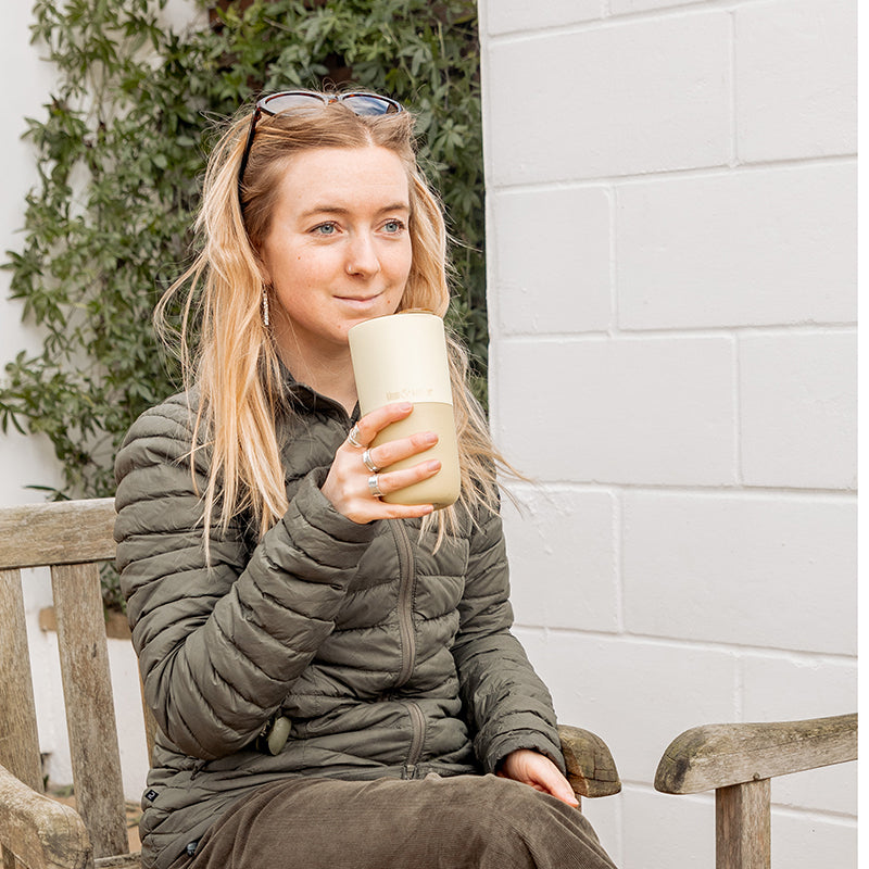 16oz-rise-tumbler-b4 16oz_rise_tumbler_wax_yellow_woman_seat_outside_square.jpg