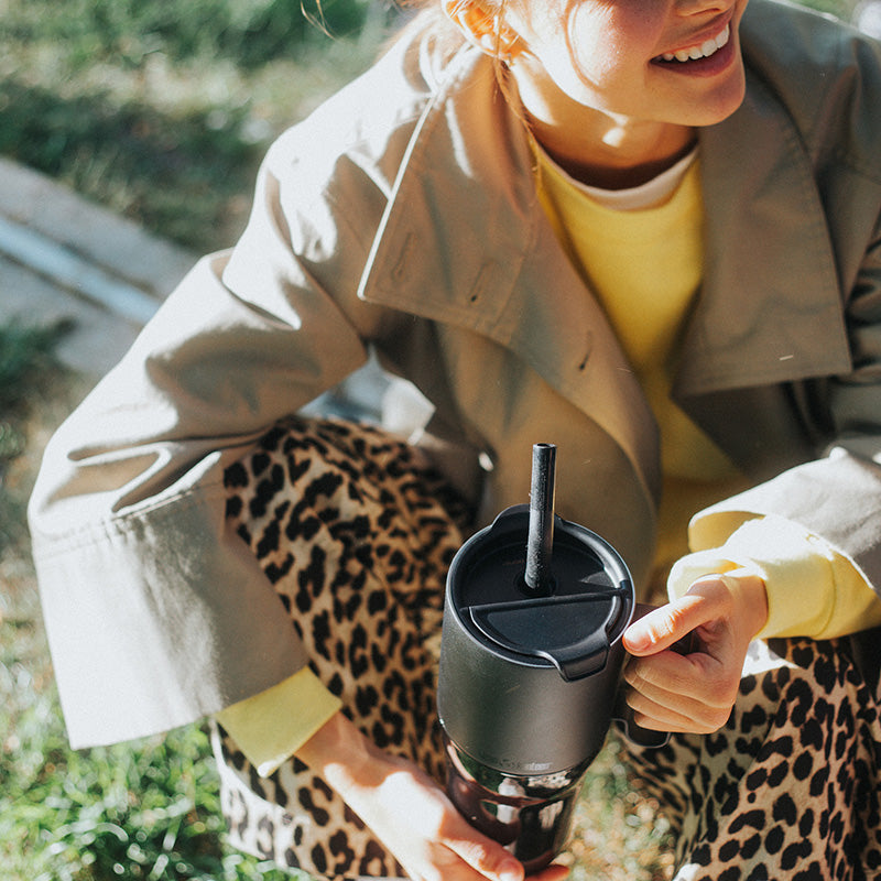 26oz-rise-tumbler-with-straw-lid-q1 26oz_rise_tumbler_black_woman_topview_square.jpg