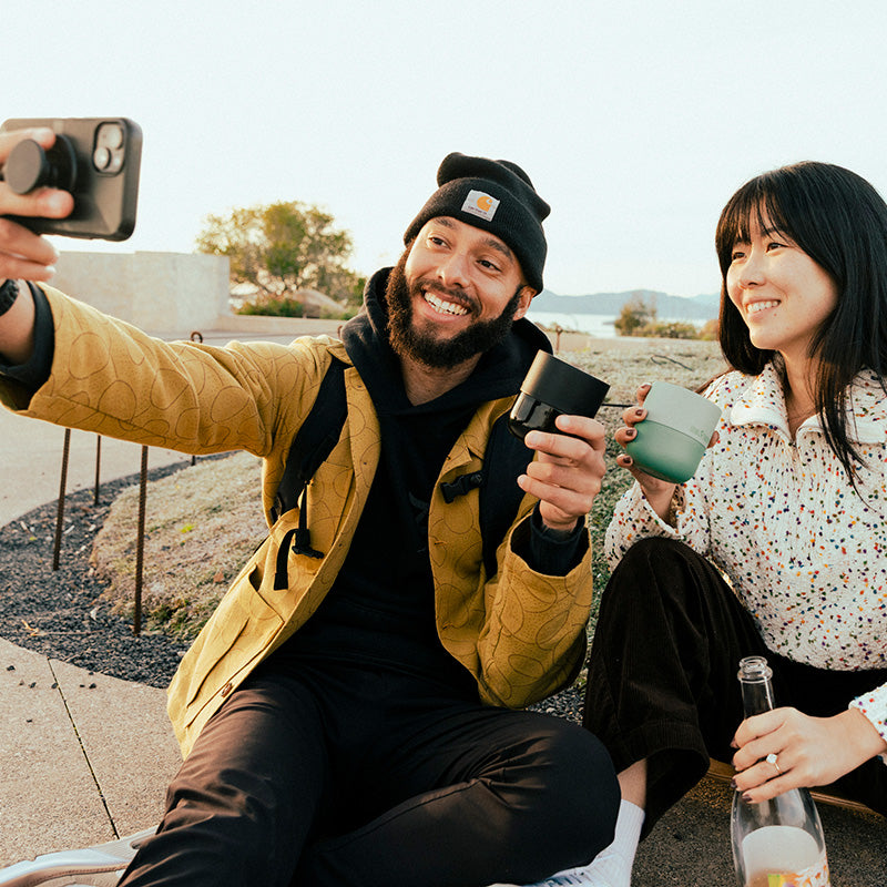 bring-your-own-party-kit-tumblers-and-cocktails-c5 8oz_rise_lowball_black_iceberg_couple_selfie_city_square.jpg