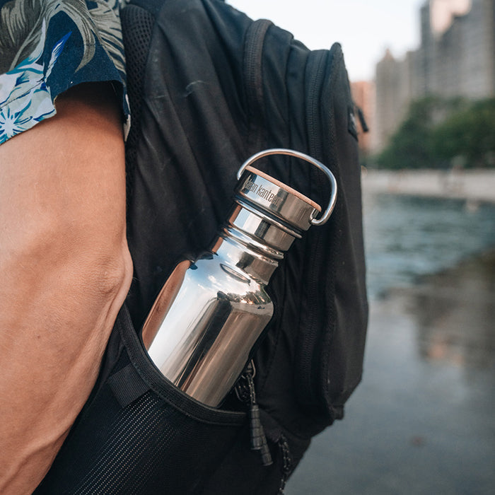 27oz-reflect-with-bamboo-cap-a6 K27SSLRF-MS-BAMBOO_reflect-bottle_backpack_lifestyle.jpg