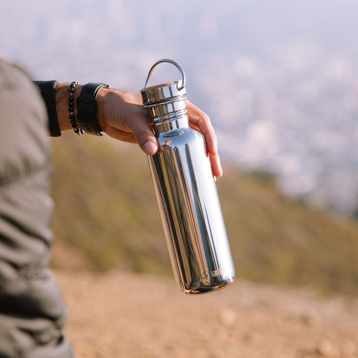 27oz-reflect-with-bamboo-cap-a6 K27SSLRF-MS-BAMBOO_reflect_bottle_hand_lifestyle.jpg